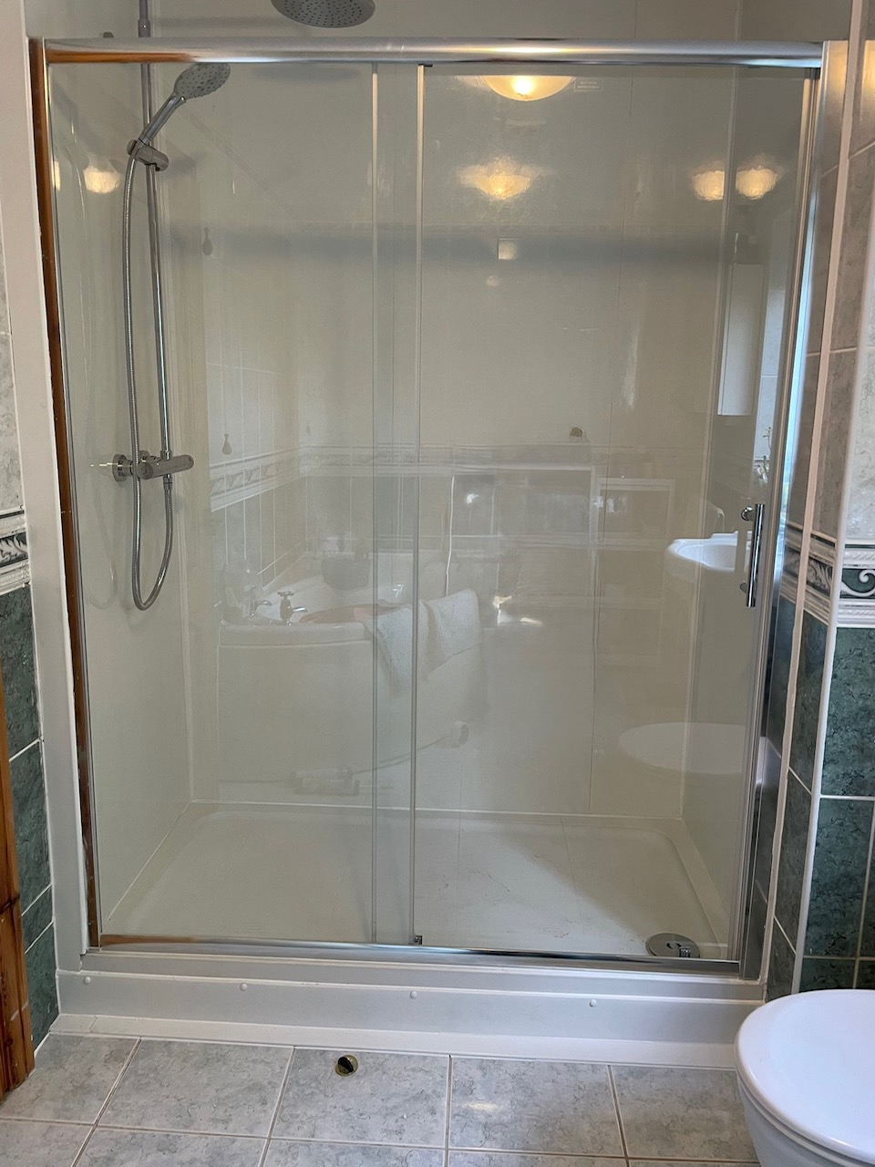 Completed glass shower enclosure with new tray and fittings