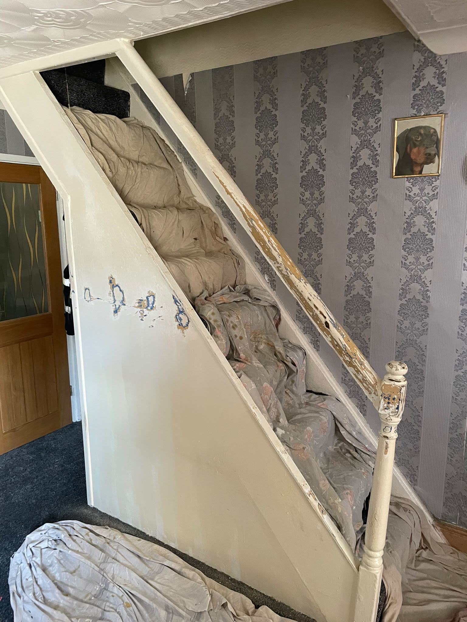 Worn white painted staircase before refurbishment